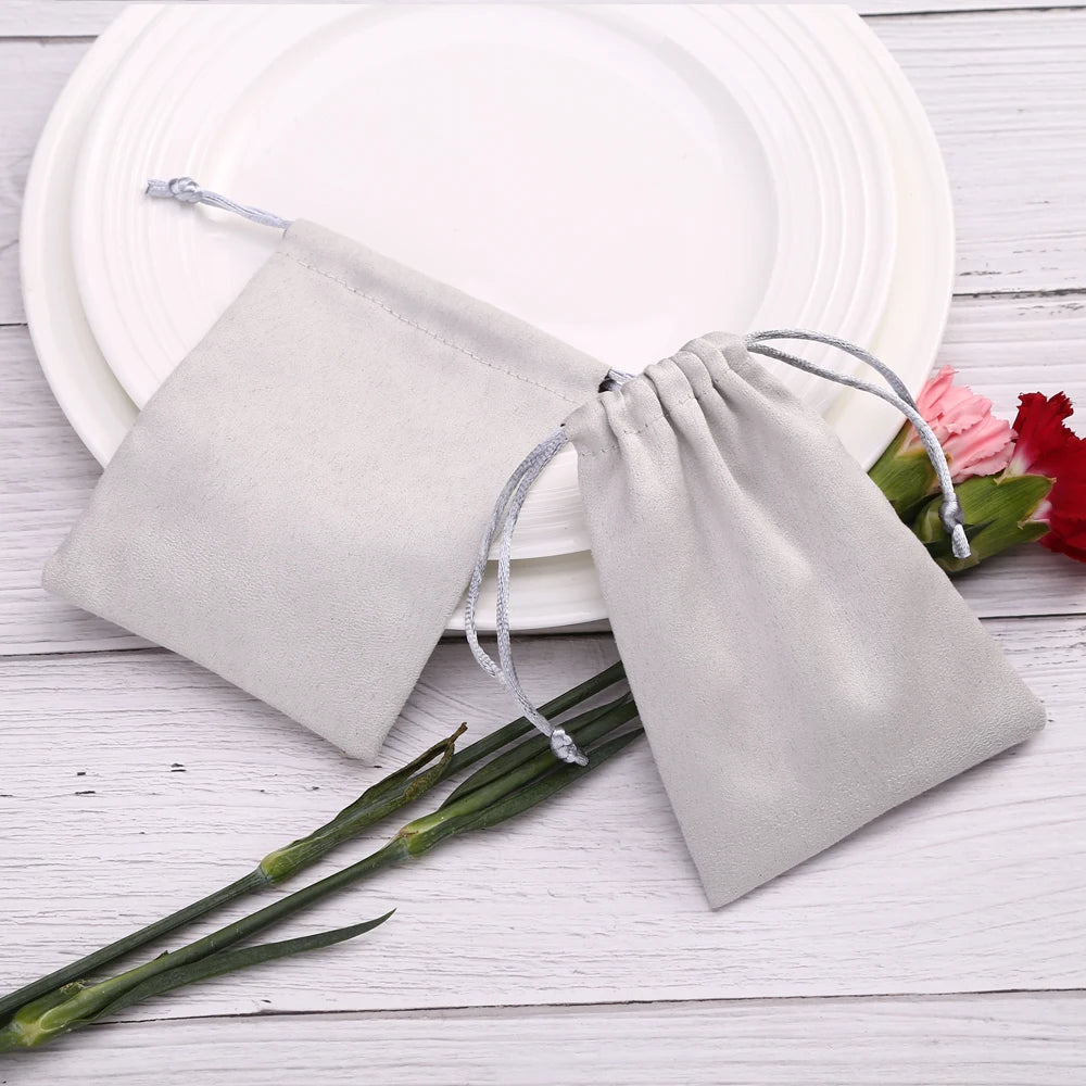 50pcs 7x9cm Light Blue Flannel Drawstring Packing Jewelry Packaging Display Luxury Velvet Suede Pouches Wedding Favors Gift Bags