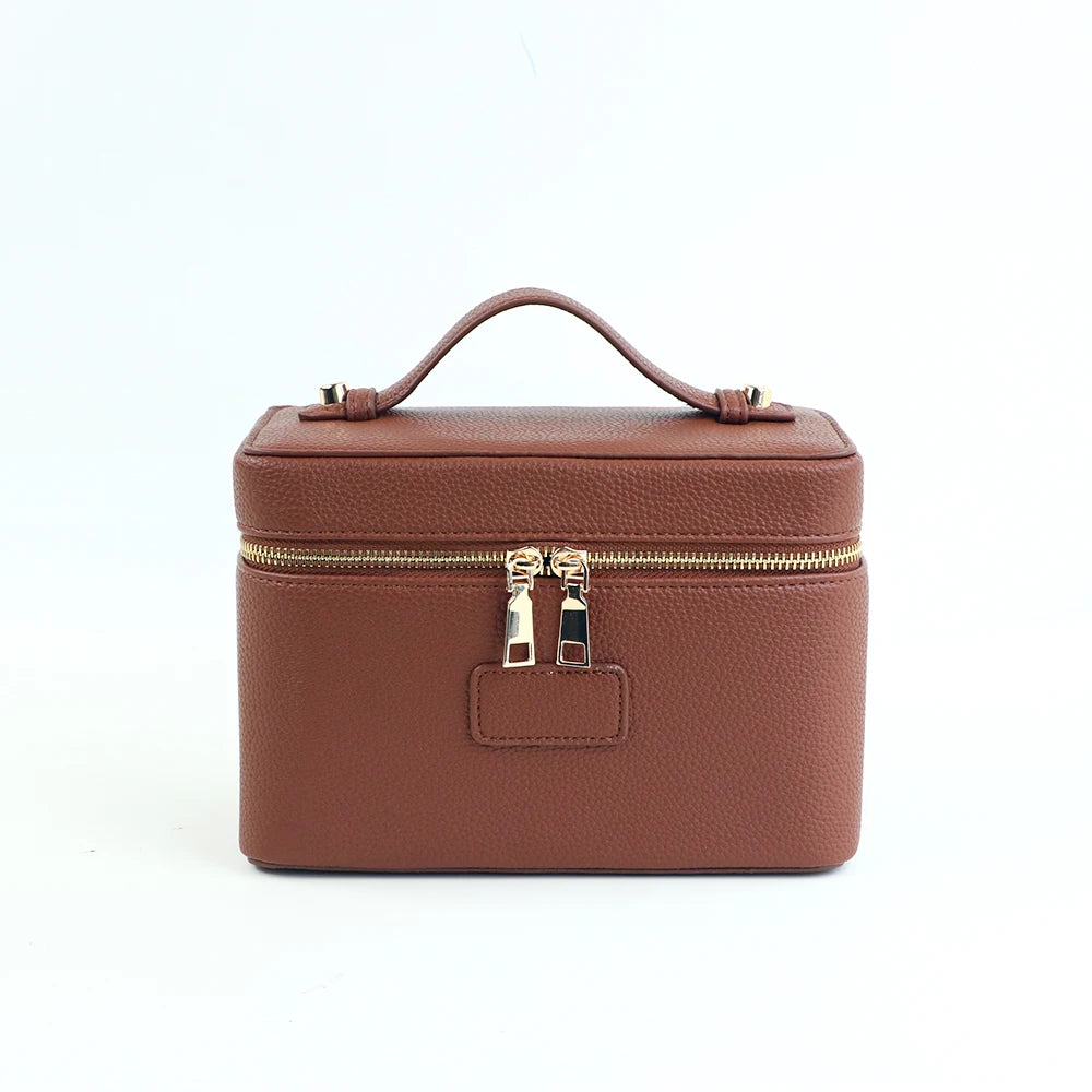 Customized name PU leather makeup bag with compartmentalized storage design, large capacity, and includes a makeup bag.