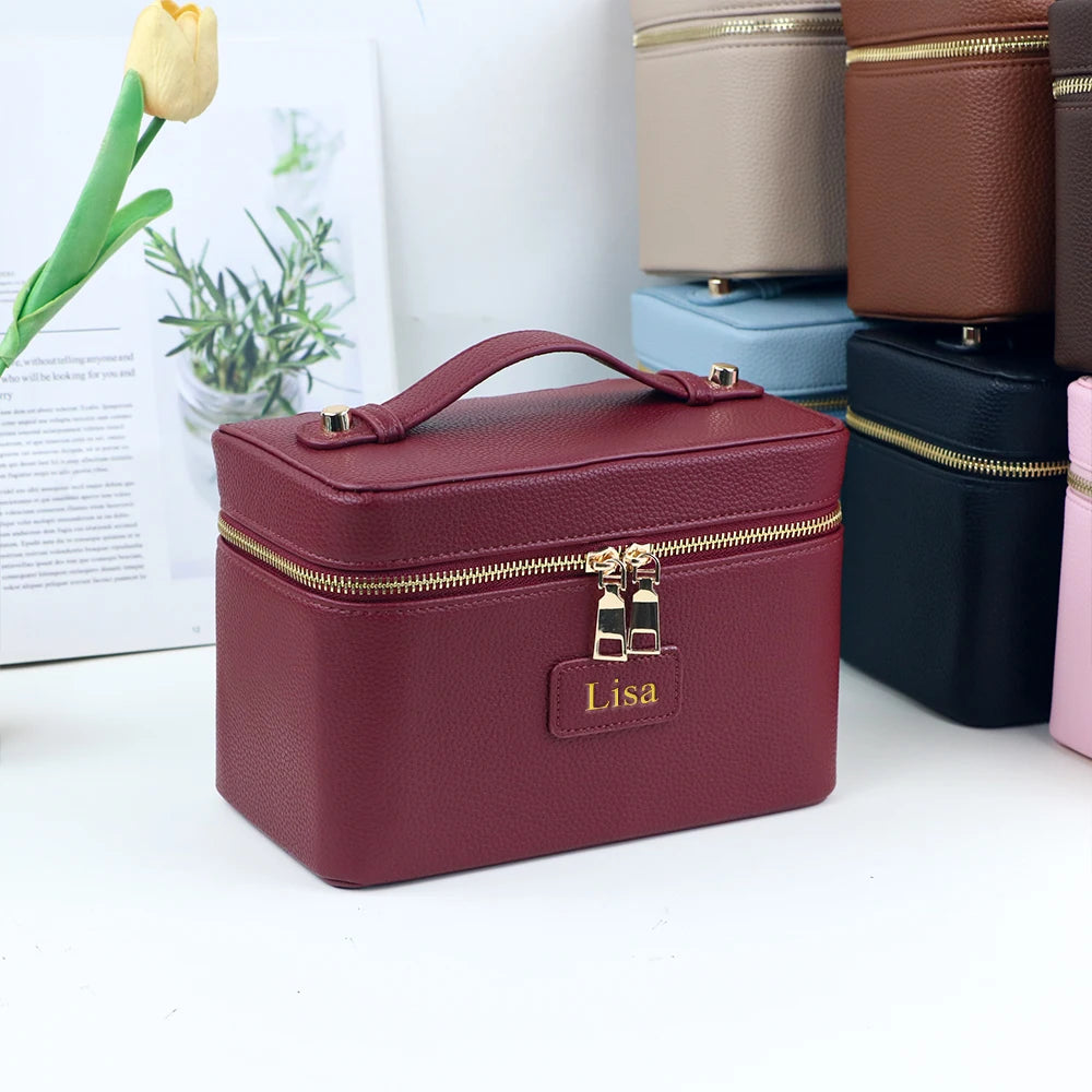 Customized name PU leather makeup bag with compartmentalized storage design, large capacity, and includes a makeup bag.