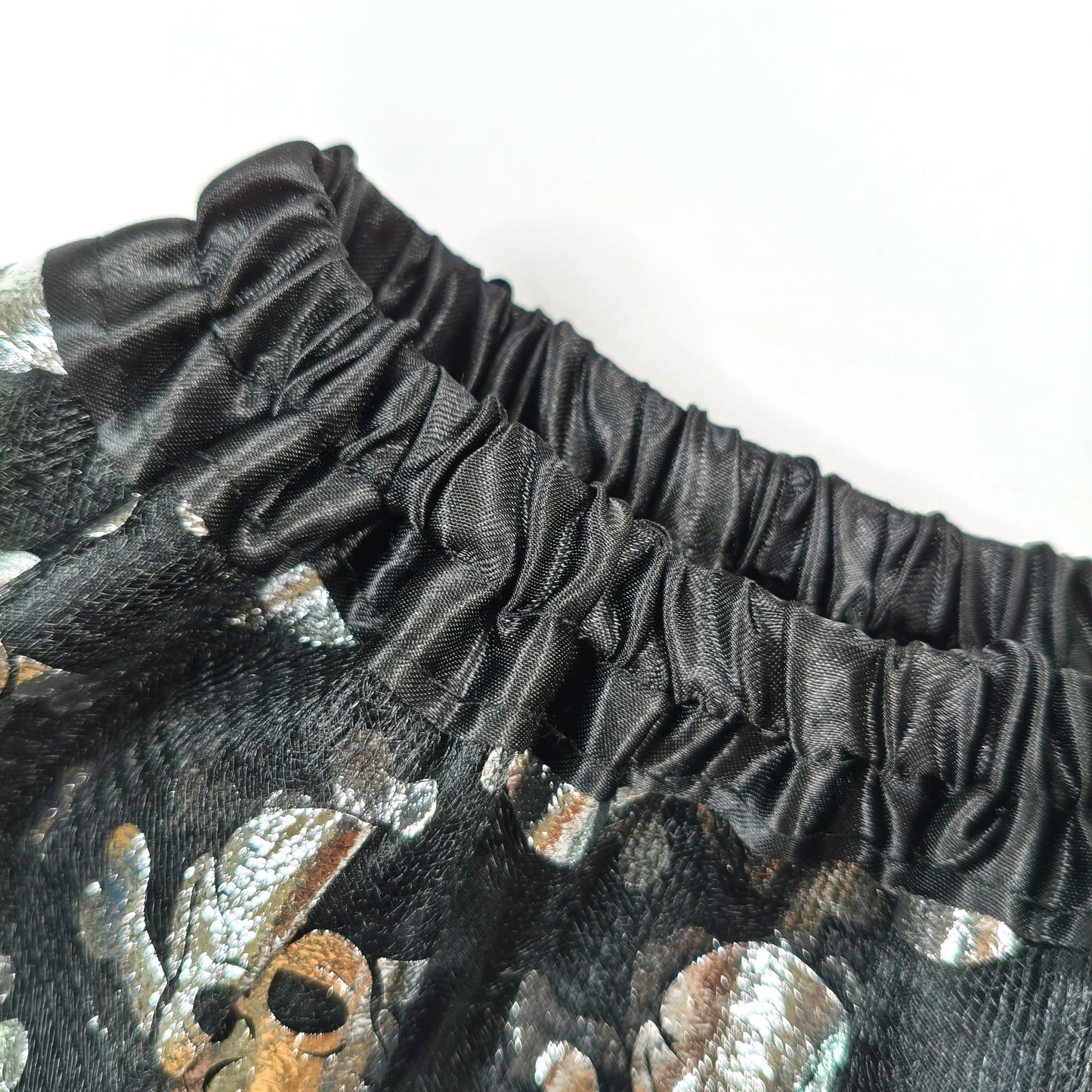 Halloween Adults Tulle Skirt Adorned with bats pumpkins stars this orange tulle skirt has a black bow waist  trim