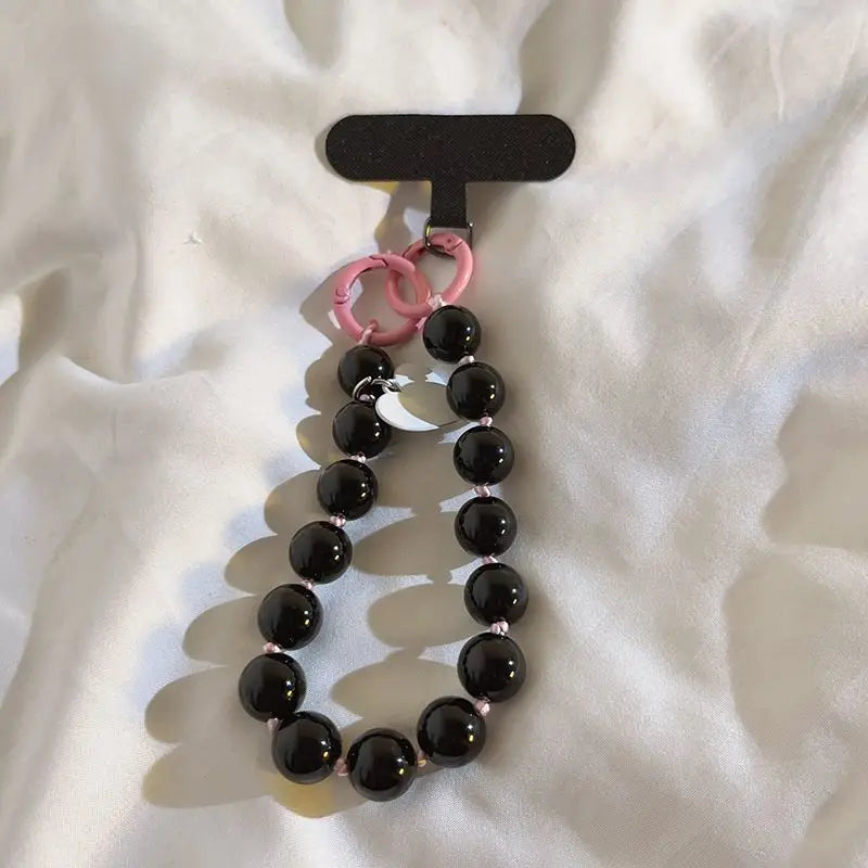 1 x Unisex plain, minimalist mobile phone wrist strap; available in 8 colours with beaded heart-shaped charms; versatile mobile