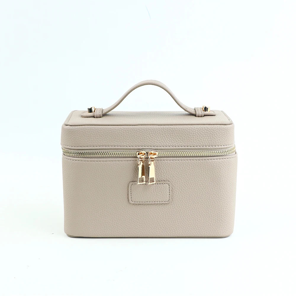 Customized name PU leather makeup bag with compartmentalized storage design, large capacity, and includes a makeup bag.