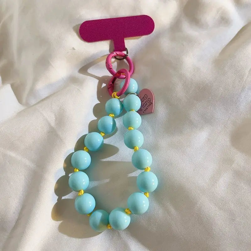 1 x Unisex plain, minimalist mobile phone wrist strap; available in 8 colours with beaded heart-shaped charms; versatile mobile