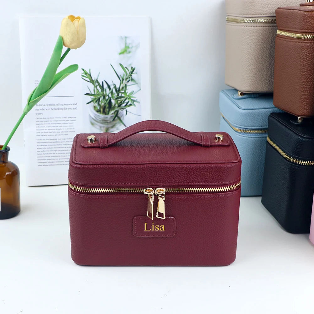 Customized name PU leather makeup bag with compartmentalized storage design, large capacity, and includes a makeup bag.