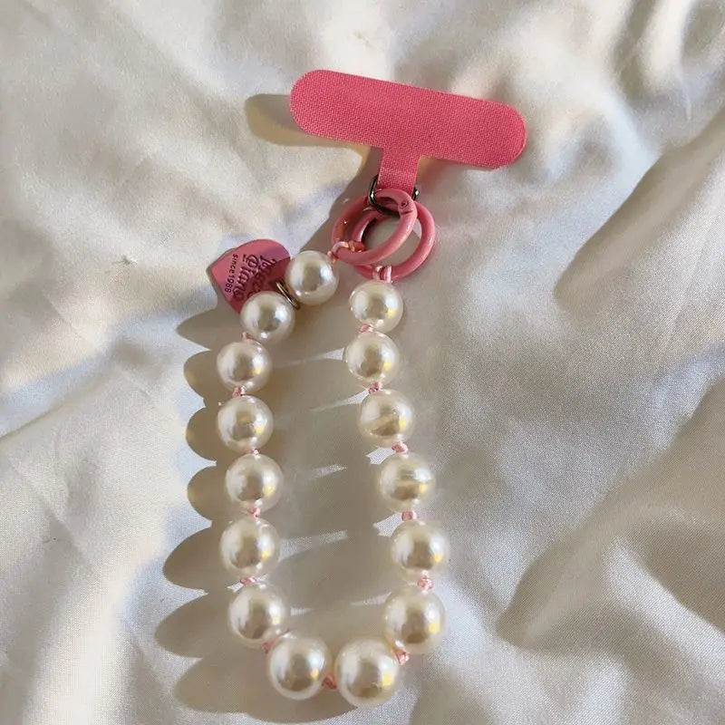 1 x Unisex plain, minimalist mobile phone wrist strap; available in 8 colours with beaded heart-shaped charms; versatile mobile