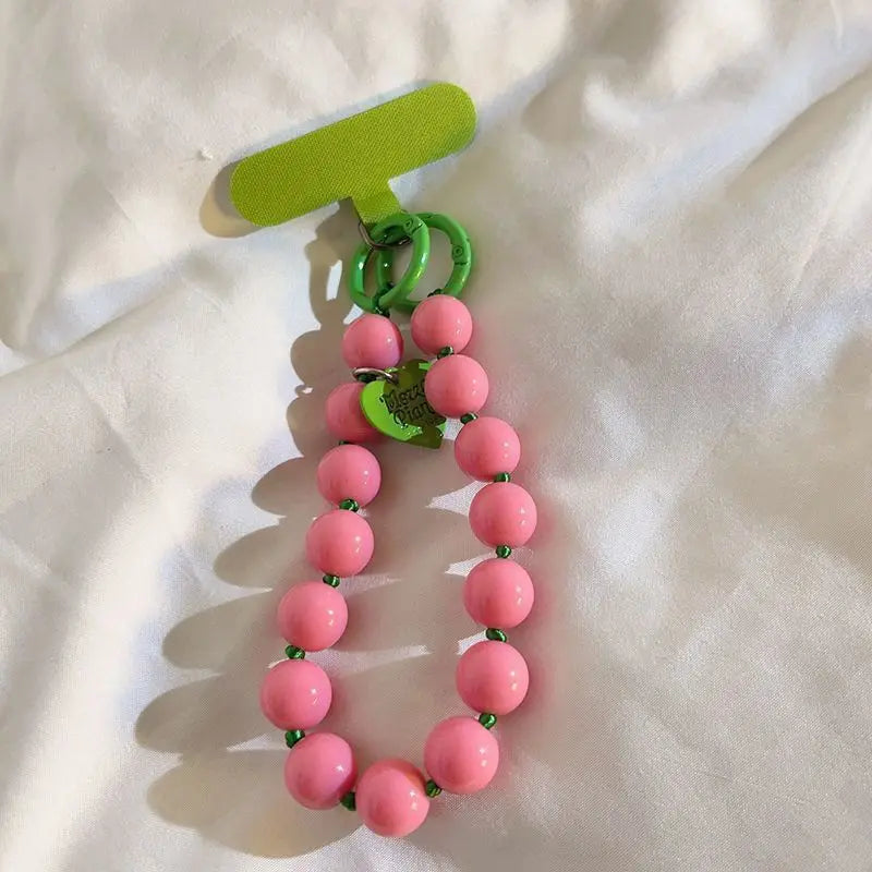1 x Unisex plain, minimalist mobile phone wrist strap; available in 8 colours with beaded heart-shaped charms; versatile mobile