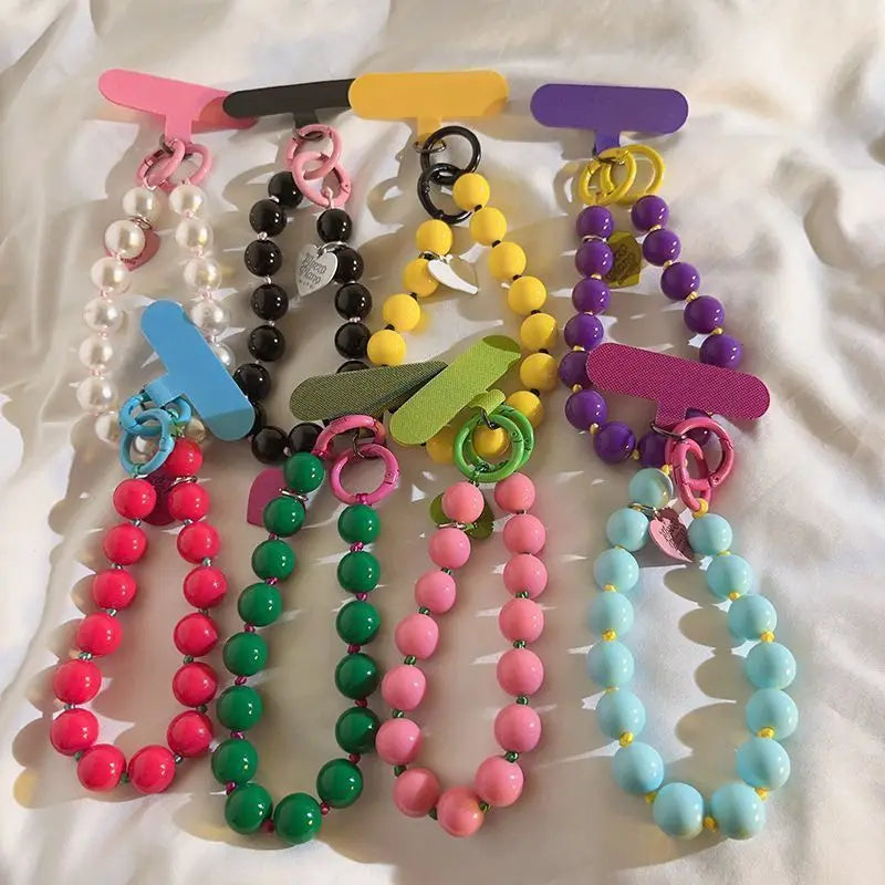 1 x Unisex plain, minimalist mobile phone wrist strap; available in 8 colours with beaded heart-shaped charms; versatile mobile