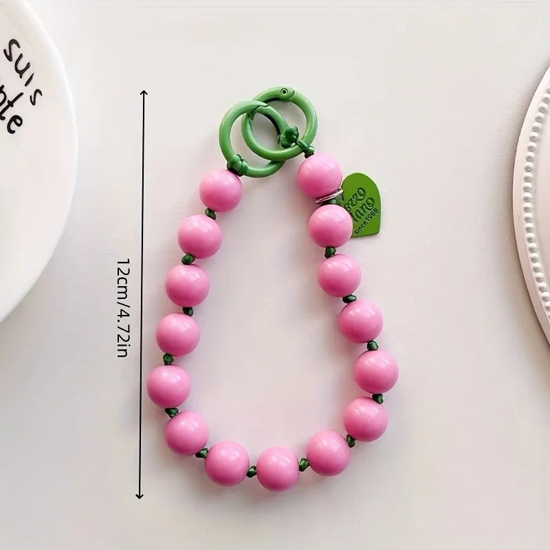 1 x Unisex plain, minimalist mobile phone wrist strap; available in 8 colours with beaded heart-shaped charms; versatile mobile