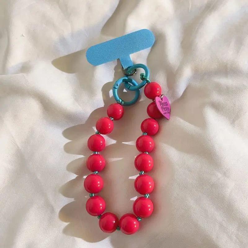 1 x Unisex plain, minimalist mobile phone wrist strap; available in 8 colours with beaded heart-shaped charms; versatile mobile